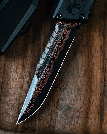 Nóż automatyczny OTF Microtech Custom Combat Troodon LT Interceptor Signature Black Aluminium, Baker Forge Raindrop CopperMai Damascus by Tony Marfione (1217-16MS1)